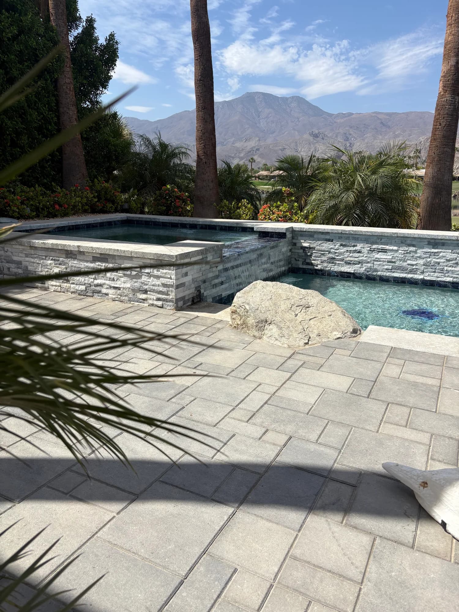 Stone patio overlooking the PWG pool and desert mountains