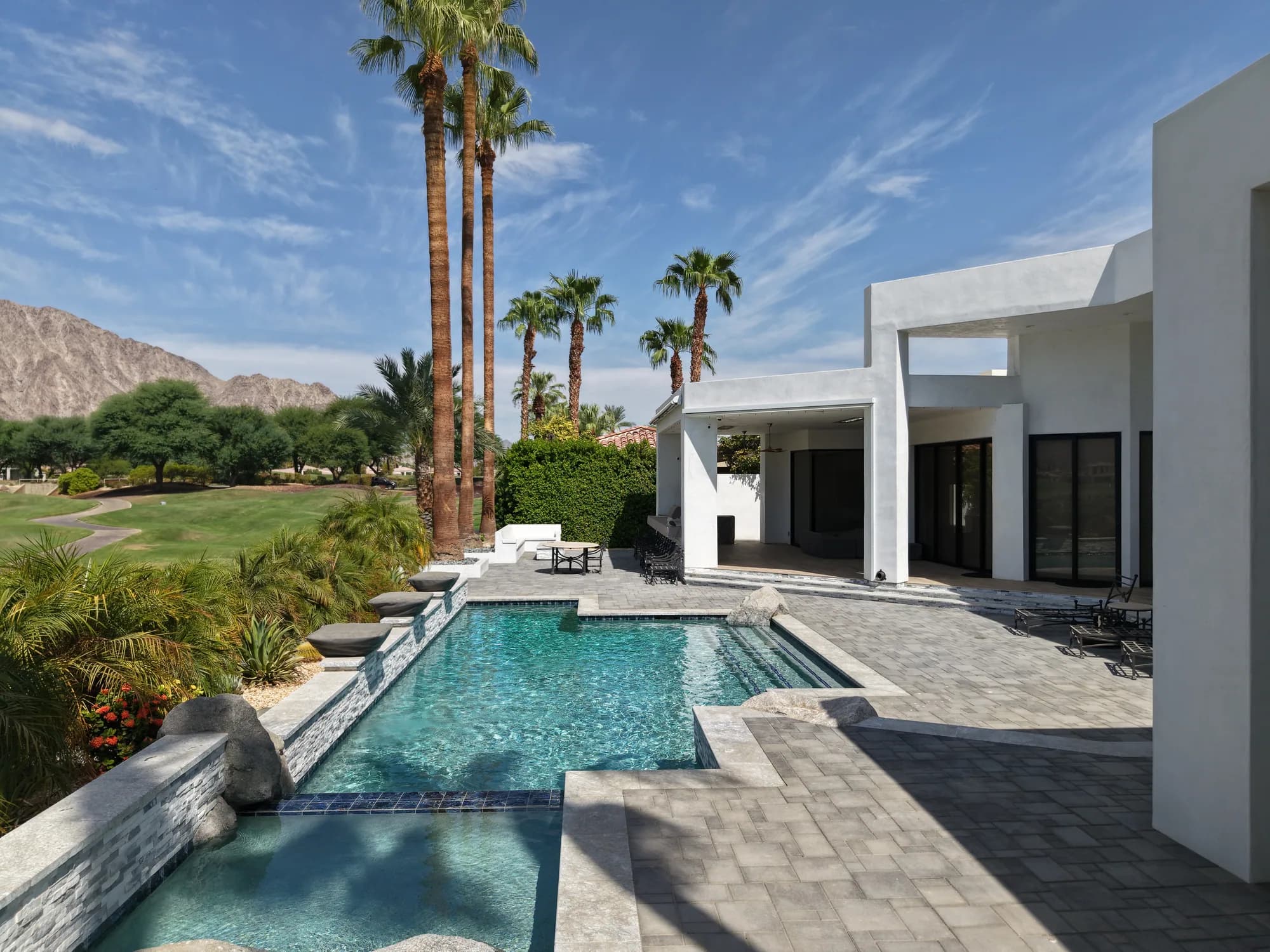 PWG pool and spa with palm trees and mountain views by JB Pools