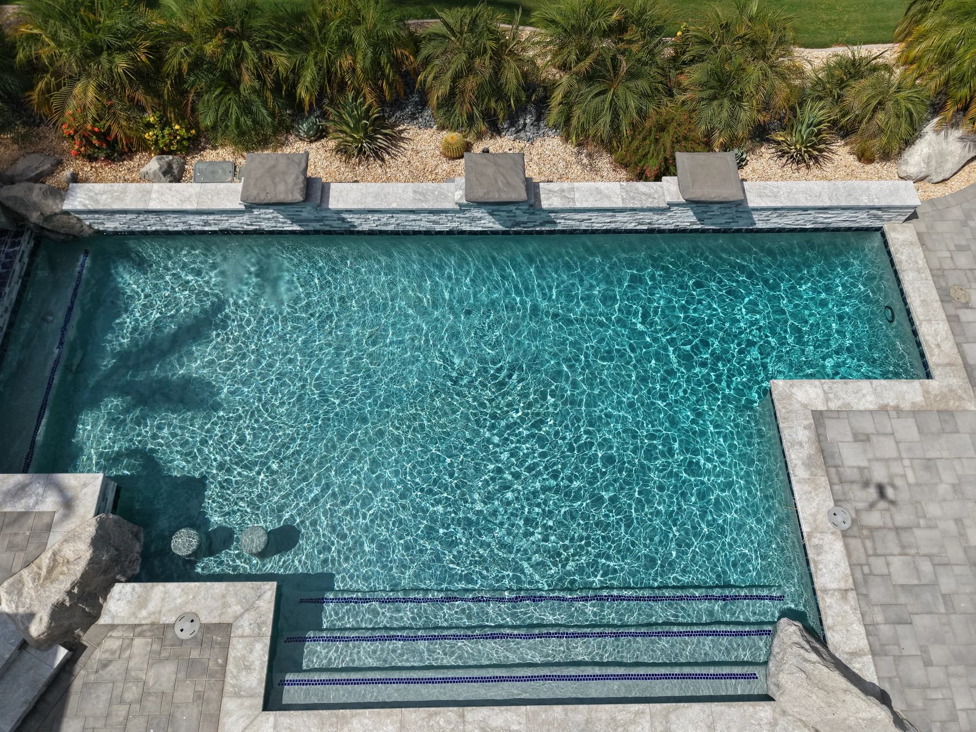 Overhead view of the PWG pool, entry steps, and surrounding stone patio